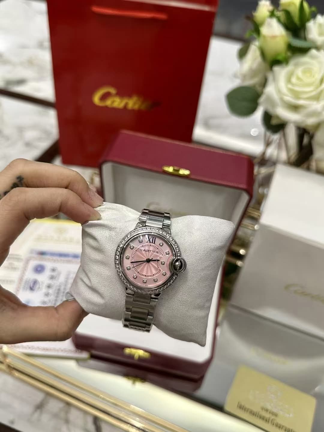 Pink face Cart watch with box {exact}